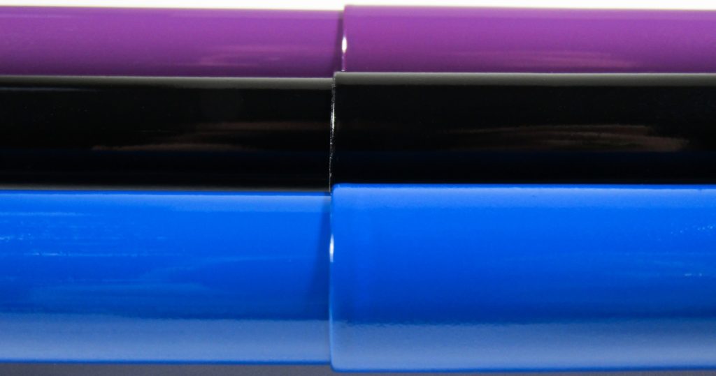 Closeup of a True Blue, Piano Black, and Plum Purple Canes to show the high gloss paint quality of each